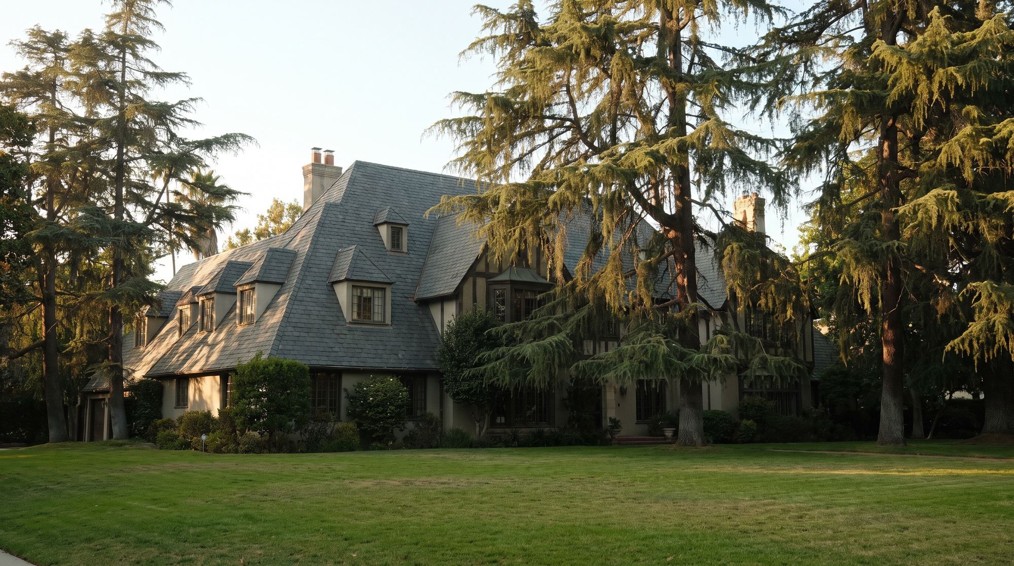 A grand period-revival house in Hancock Park with a steep roof and dormers